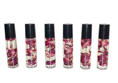 rose infused lip oil contains a variety of natural oils & rose petals