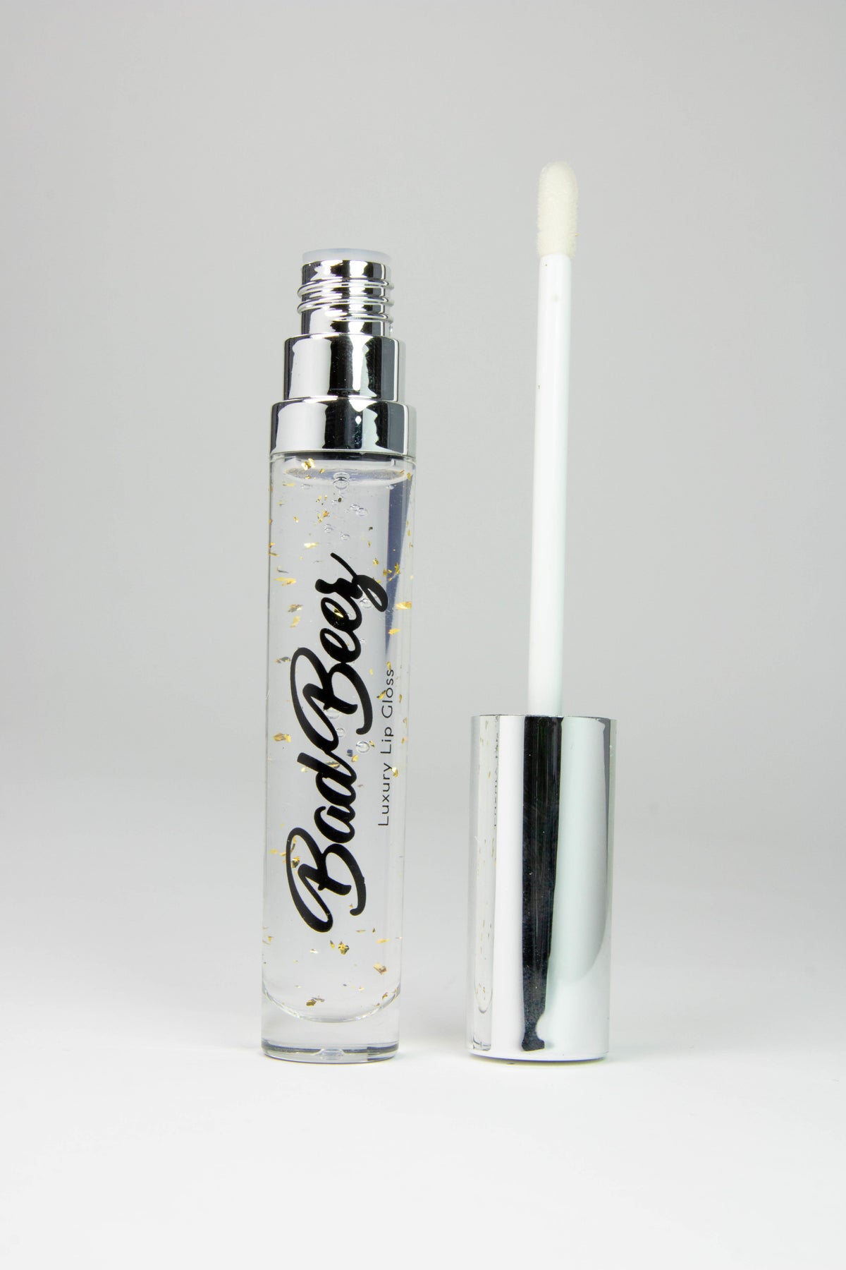 clear shiny lip gloss with gold flakes